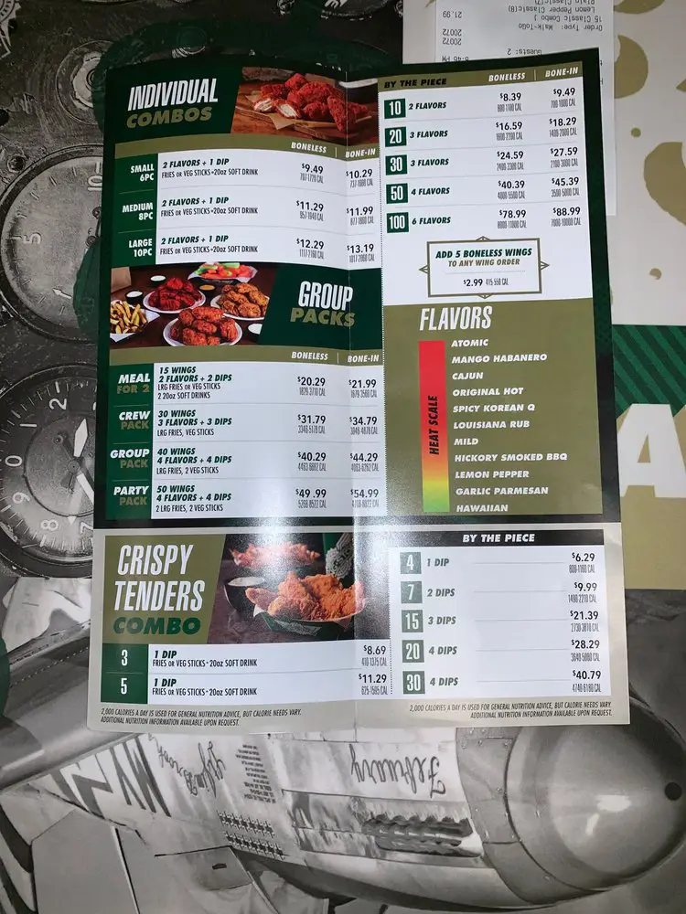 Wingstop crispy chicken sandwich tossed in signature flavor on toasted brioche bun with pickles